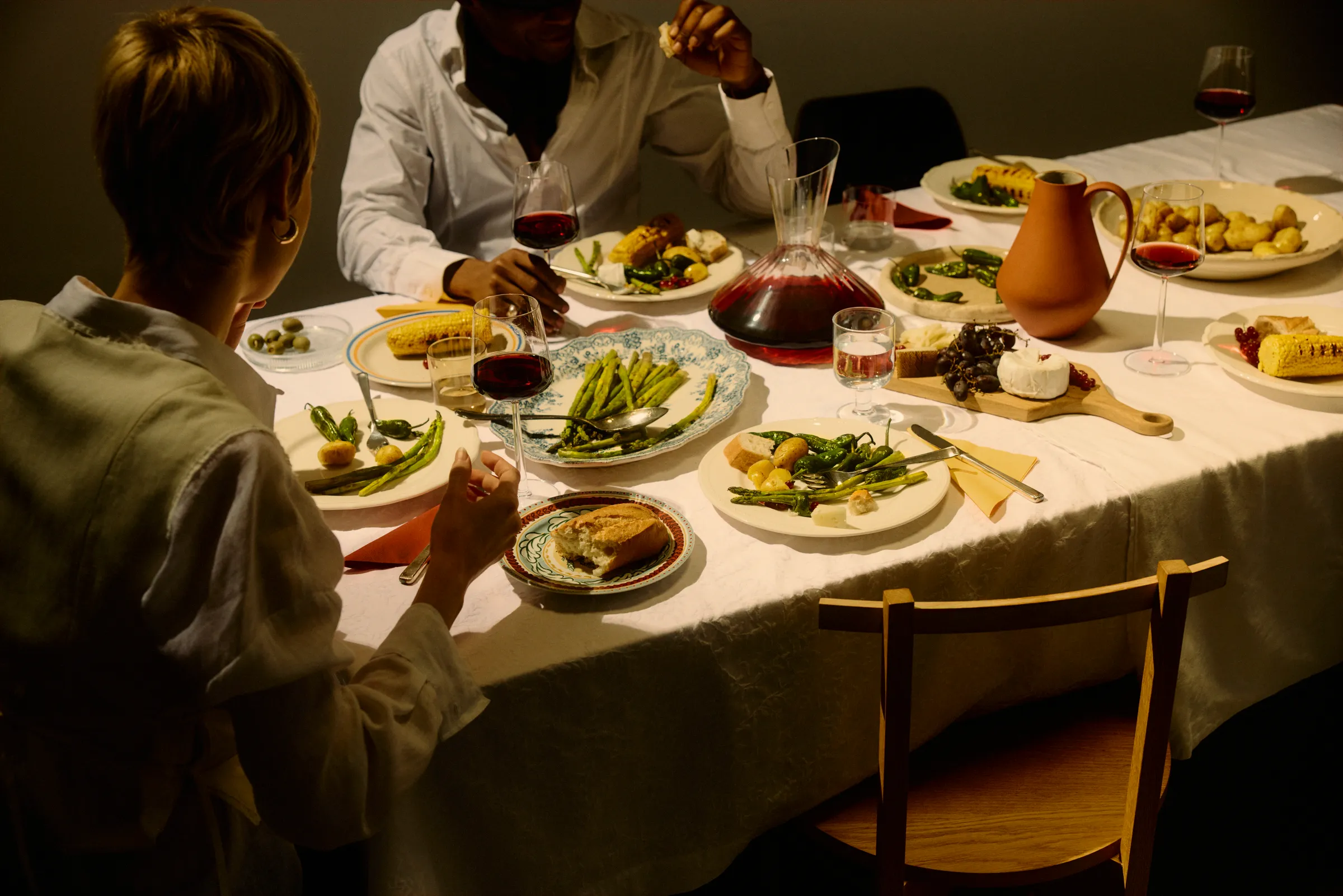A long table set with Reddy wine